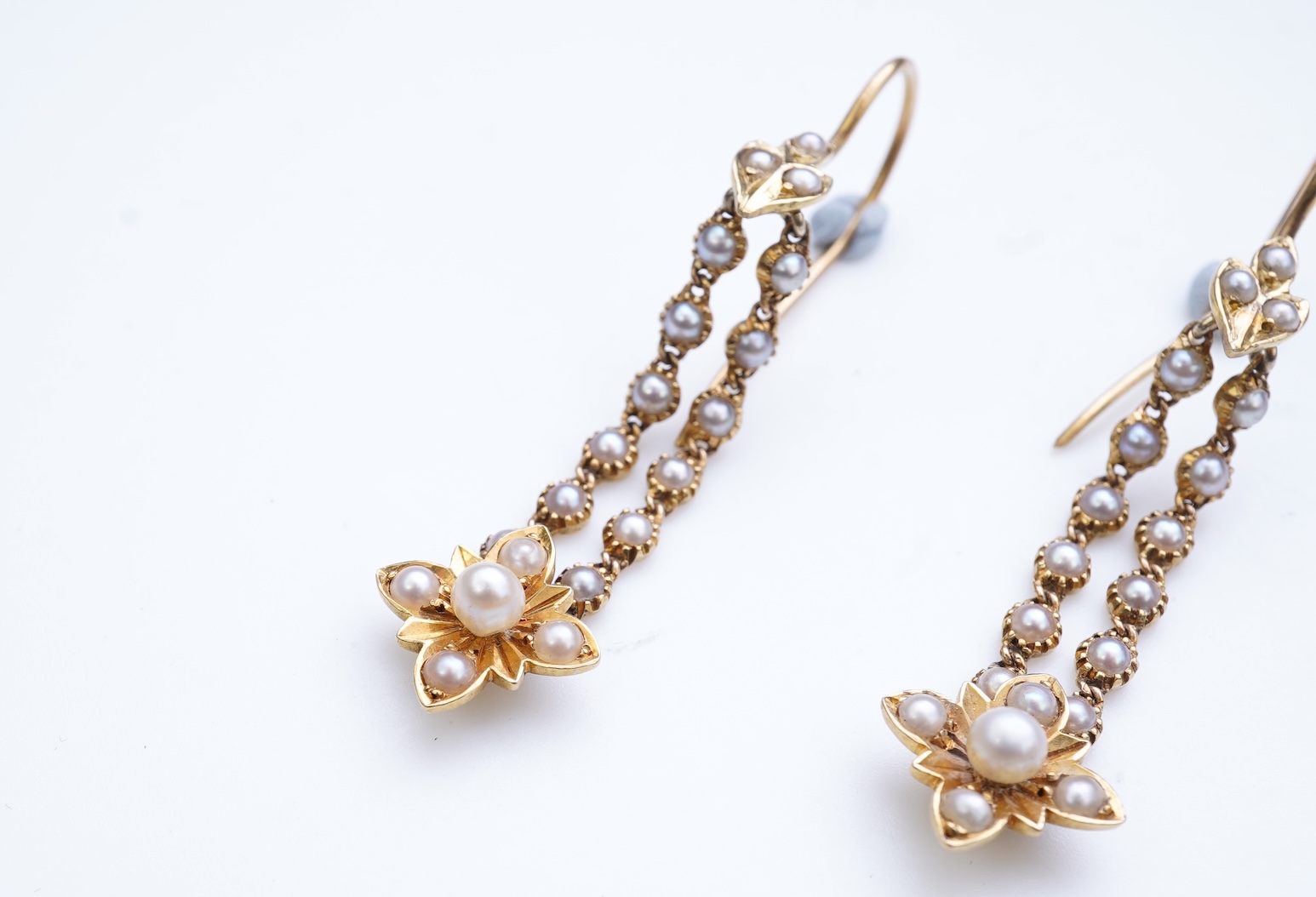 A pair of Edwardian seed pearl earrings, early 20th century composite